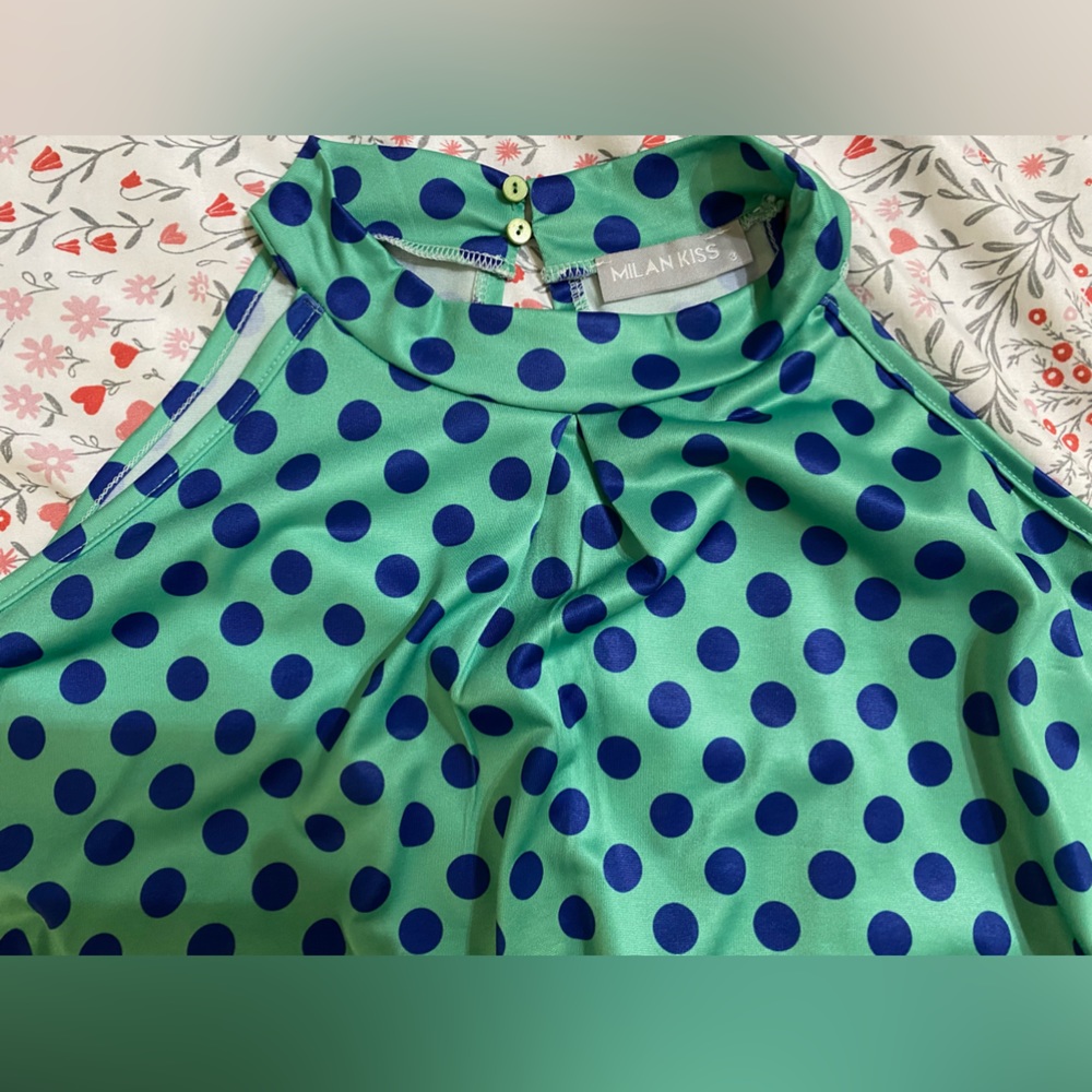 High neck polka dot beautiful top. Good on jeans or short or even under jacket.